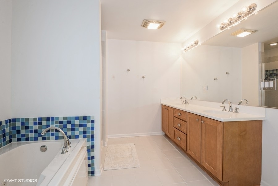 1228 Emerson Street, Unit 304 Evanston, IL 60201 - Photo 10 of 19 a bathroom with a bathtub and a sink