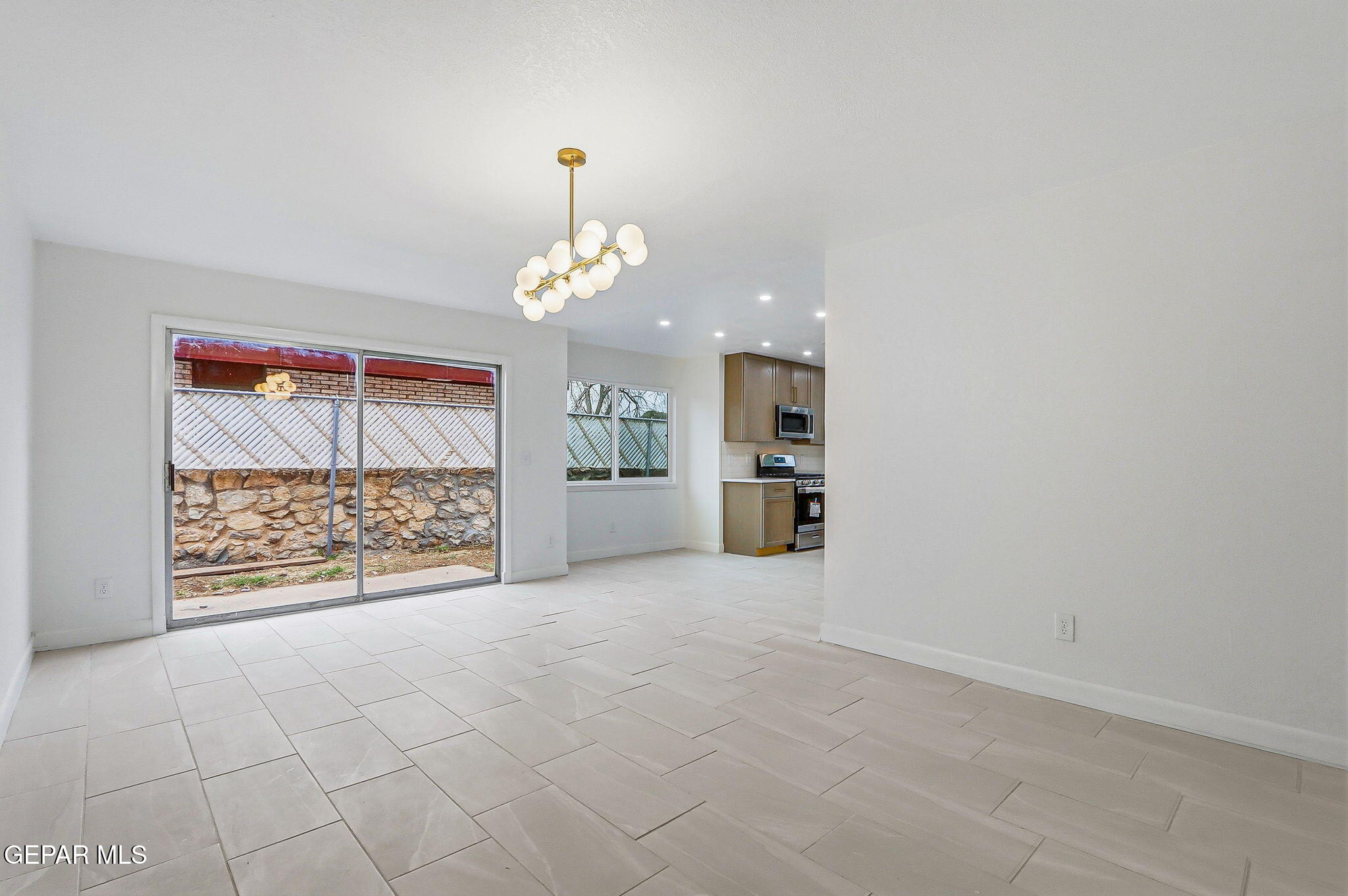 709 Frontera Road El Paso, TX 79922 - Photo 8 of 41 wooden floor in an empty room with a window