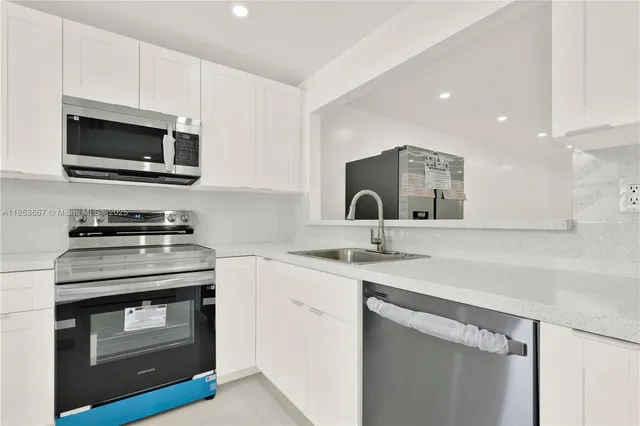 a kitchen with a stove and a microwave