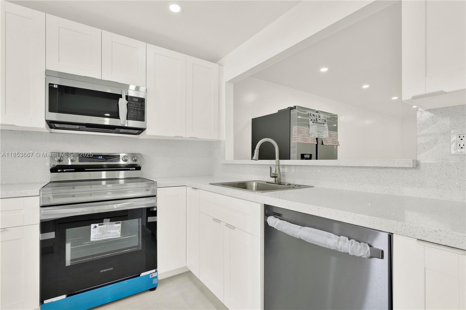 a kitchen with a stove and a microwave