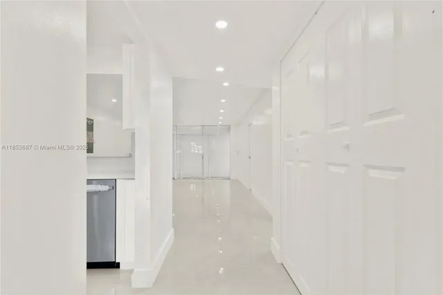 a bathroom with a shower and a glass door