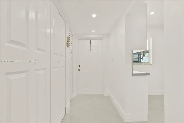 a view of a hallway with closet