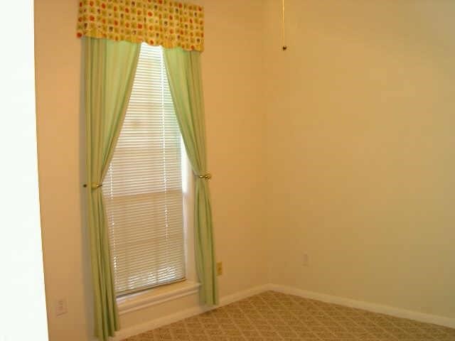 4542 Springfield Lakes Street Sugar Land, TX 77479 - Photo 15 of 16 Bright bedroom with large window and cheerful natural lighting.