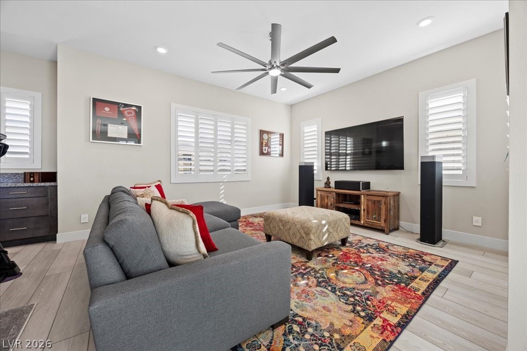 4262 Swift Street Las Vegas, NV 89135 - Photo 47 of 75 Living room with light wood-style flooring, a ceiling fan, and recessed lighting