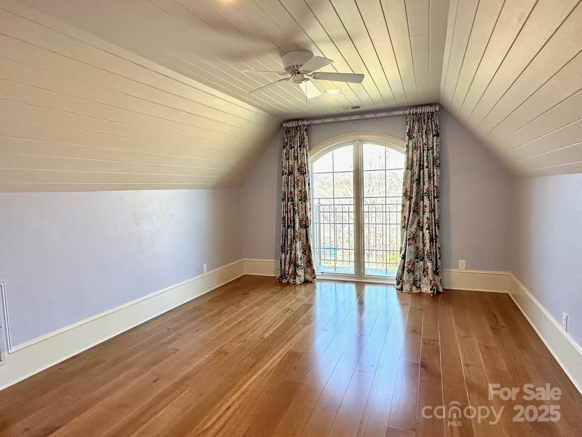 520 East Landing Ridge Circle Jefferson, NC 28640 - Photo 23 of 48 an empty room with wooden floor and windows