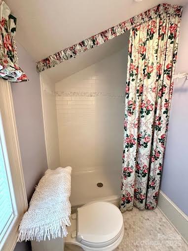 520 East Landing Ridge Circle Jefferson, NC 28640 - Photo 24 of 48 a bathroom with a toilet and shower curtain