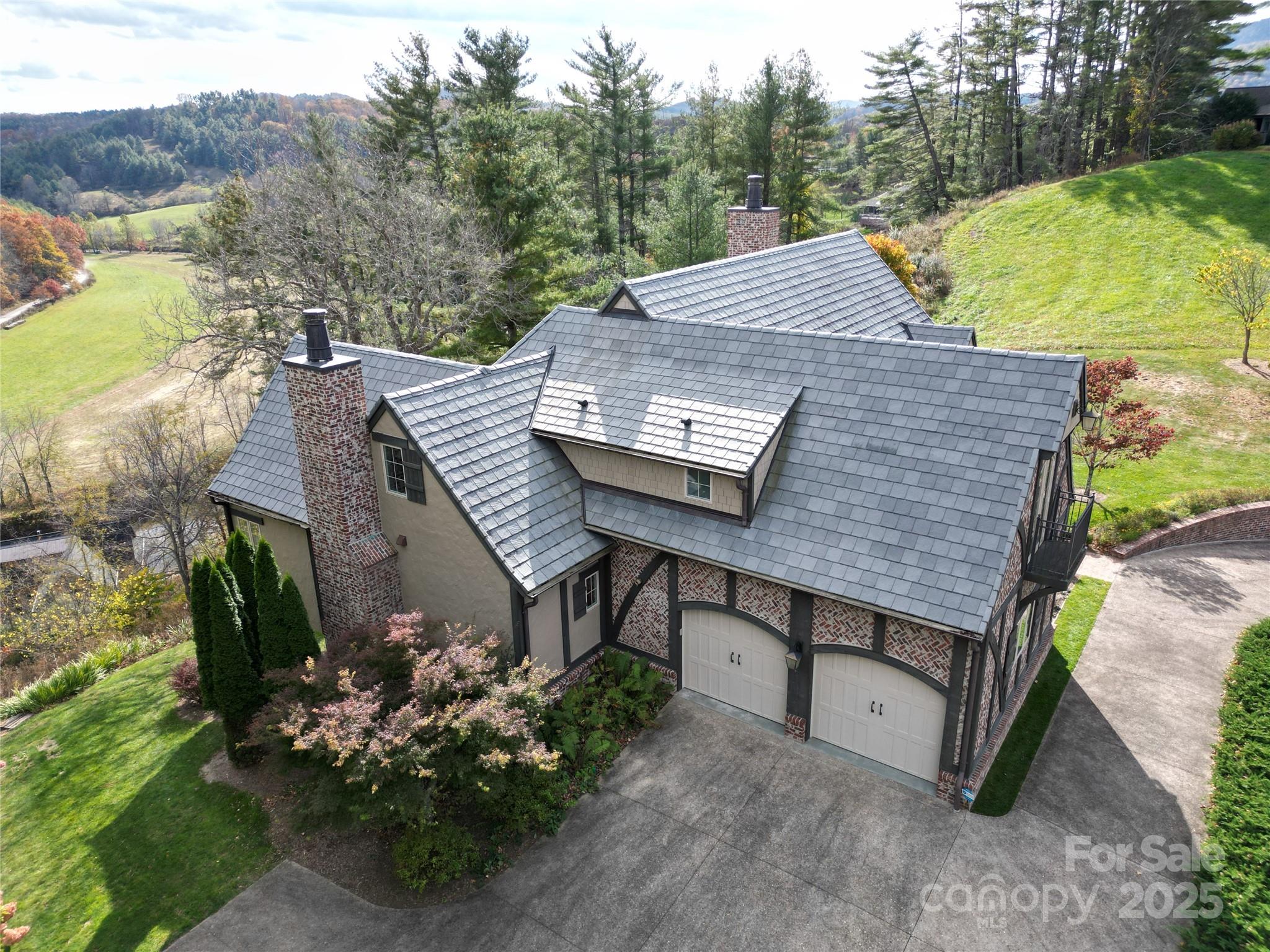 520 East Landing Ridge Circle Jefferson, NC 28640 - Photo 3 of 48 a view of a chairs and table on the terrace