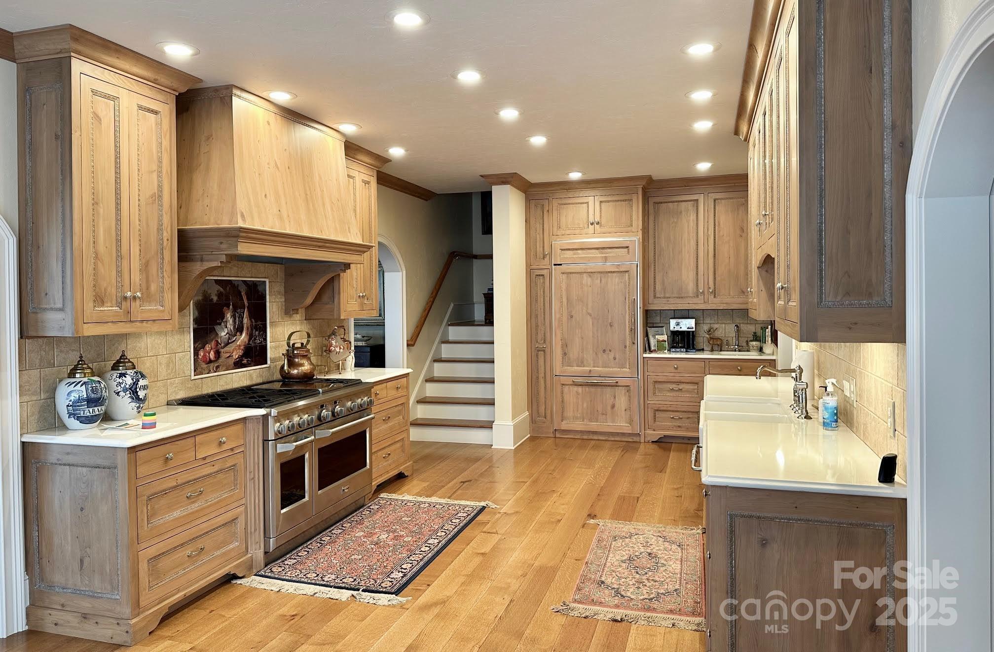 520 East Landing Ridge Circle Jefferson, NC 28640 - Photo 34 of 48 a kitchen with kitchen island granite countertop a stove and a sink