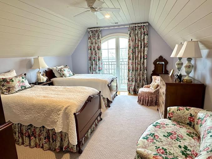 520 East Landing Ridge Circle Jefferson, NC 28640 - Photo 39 of 48 a spacious bedroom with two beds and a chandelier