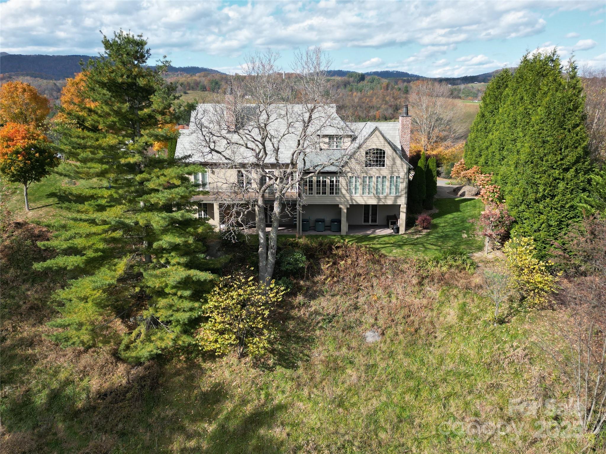 520 East Landing Ridge Circle Jefferson, NC 28640 - Photo 40 of 48 a view of a house with a yard and sitting area