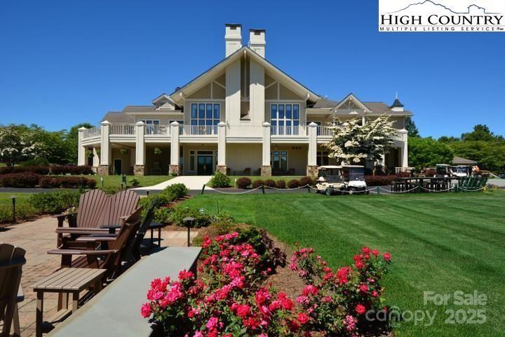 520 East Landing Ridge Circle Jefferson, NC 28640 - Photo 47 of 48 a front view of a house with a garden and sitting area