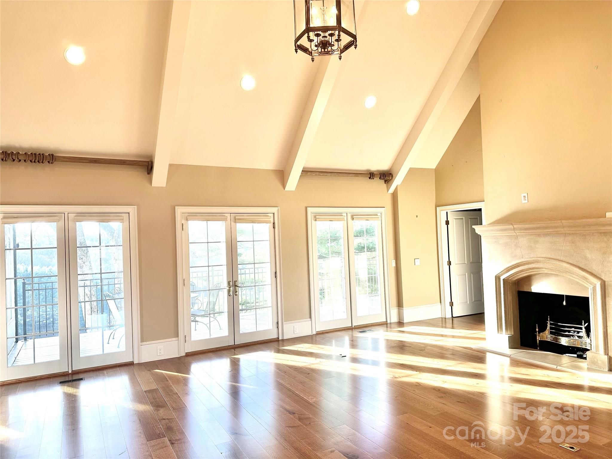 520 East Landing Ridge Circle Jefferson, NC 28640 - Photo 5 of 48 a view of an empty room with exposed radiator and fireplace