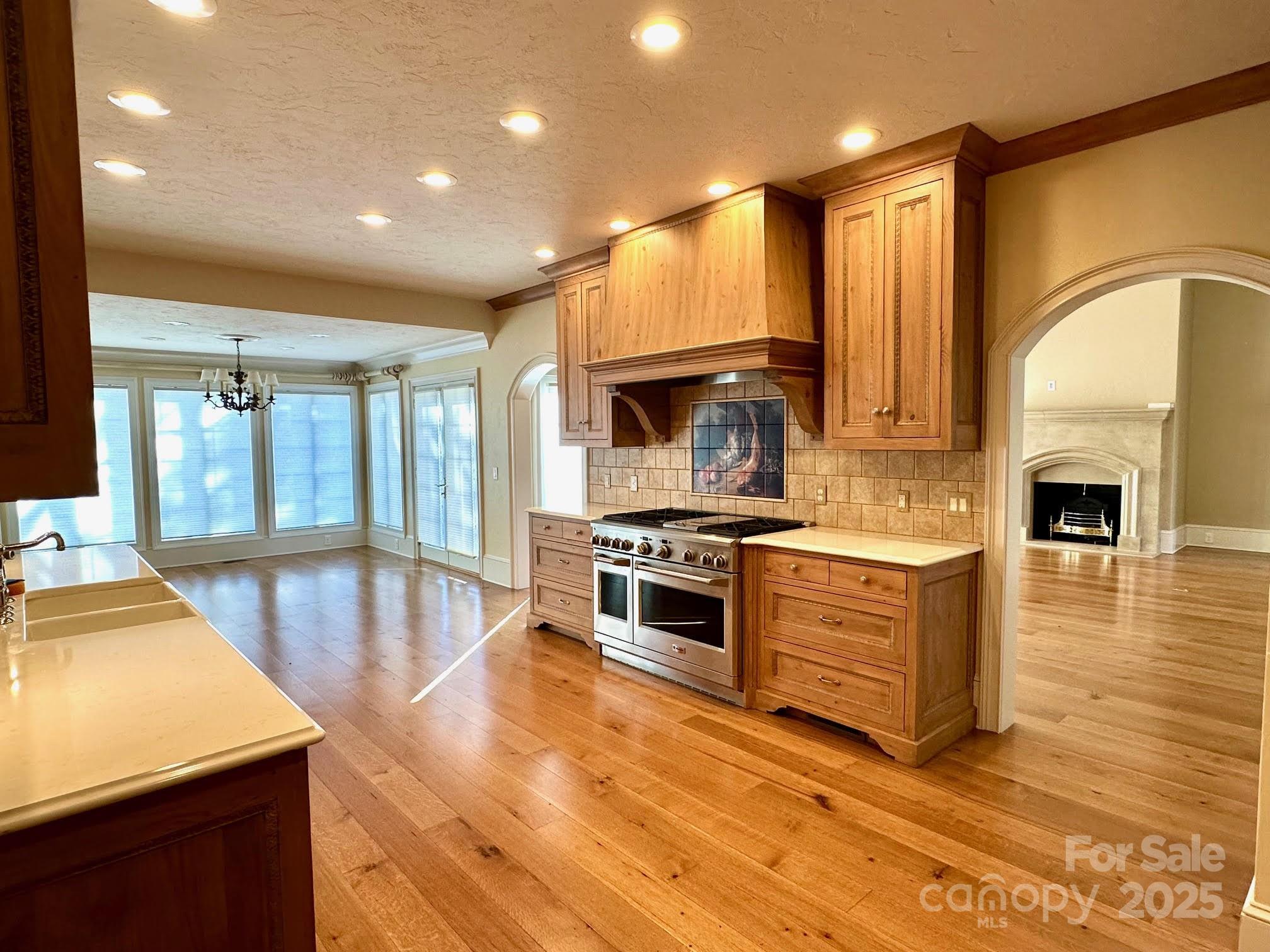 520 East Landing Ridge Circle Jefferson, NC 28640 - Photo 8 of 48 a large kitchen with stainless steel appliances granite countertop a stove a sink and a refrigerator