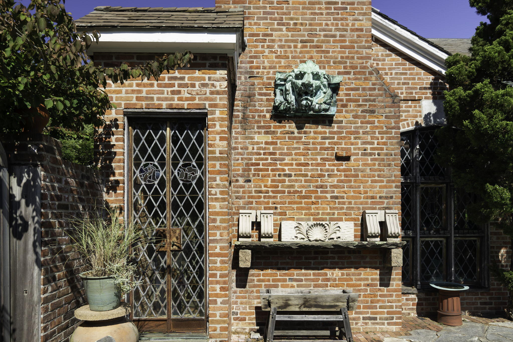 301 Michigan Road New Canaan, CT 06840 - Photo 13 of 46 a front view of a house with potted plants