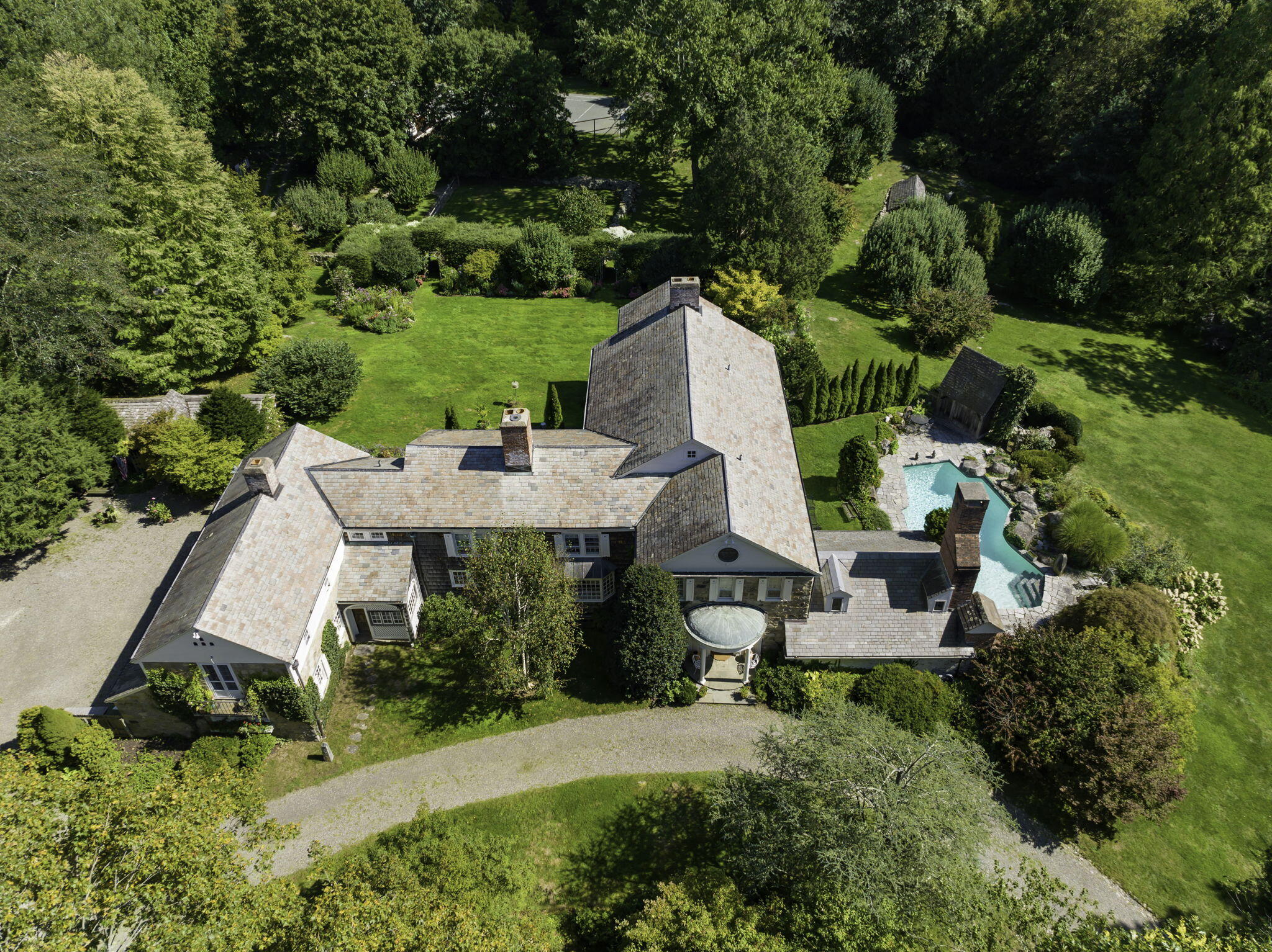 301 Michigan Road New Canaan, CT 06840 - Photo 2 of 46 an aerial view of a house with outdoor space and trees all around