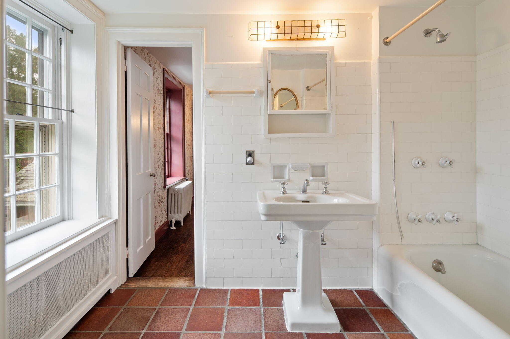 301 Michigan Road New Canaan, CT 06840 - Photo 28 of 46 a bathroom with a sink a mirror and a bathtub