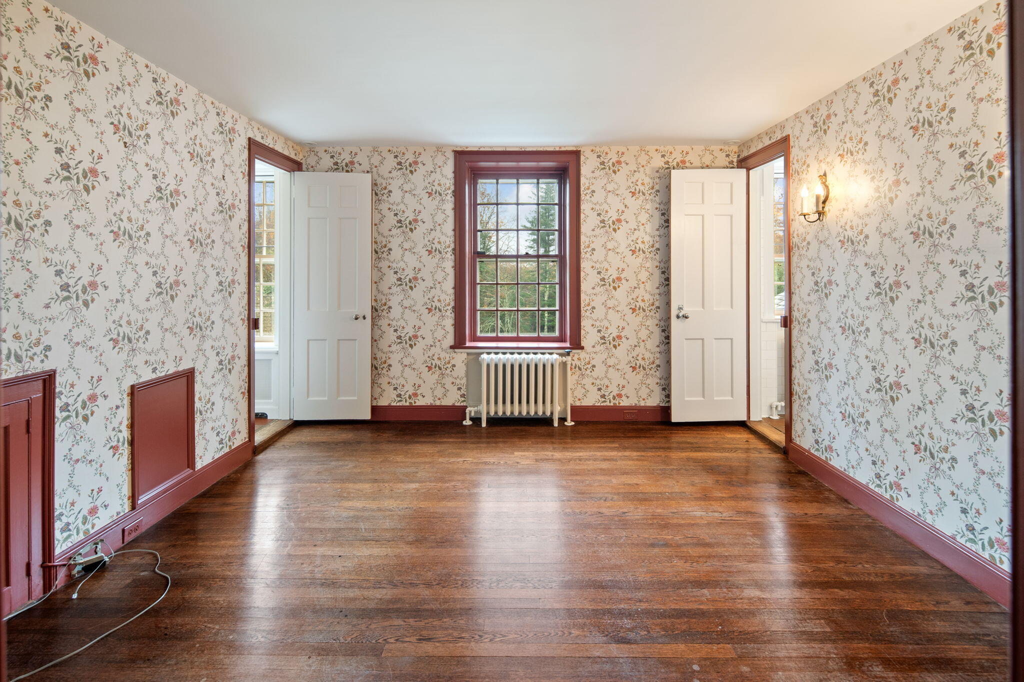 301 Michigan Road New Canaan, CT 06840 - Photo 30 of 46 a view of an empty room with window and wooden floor