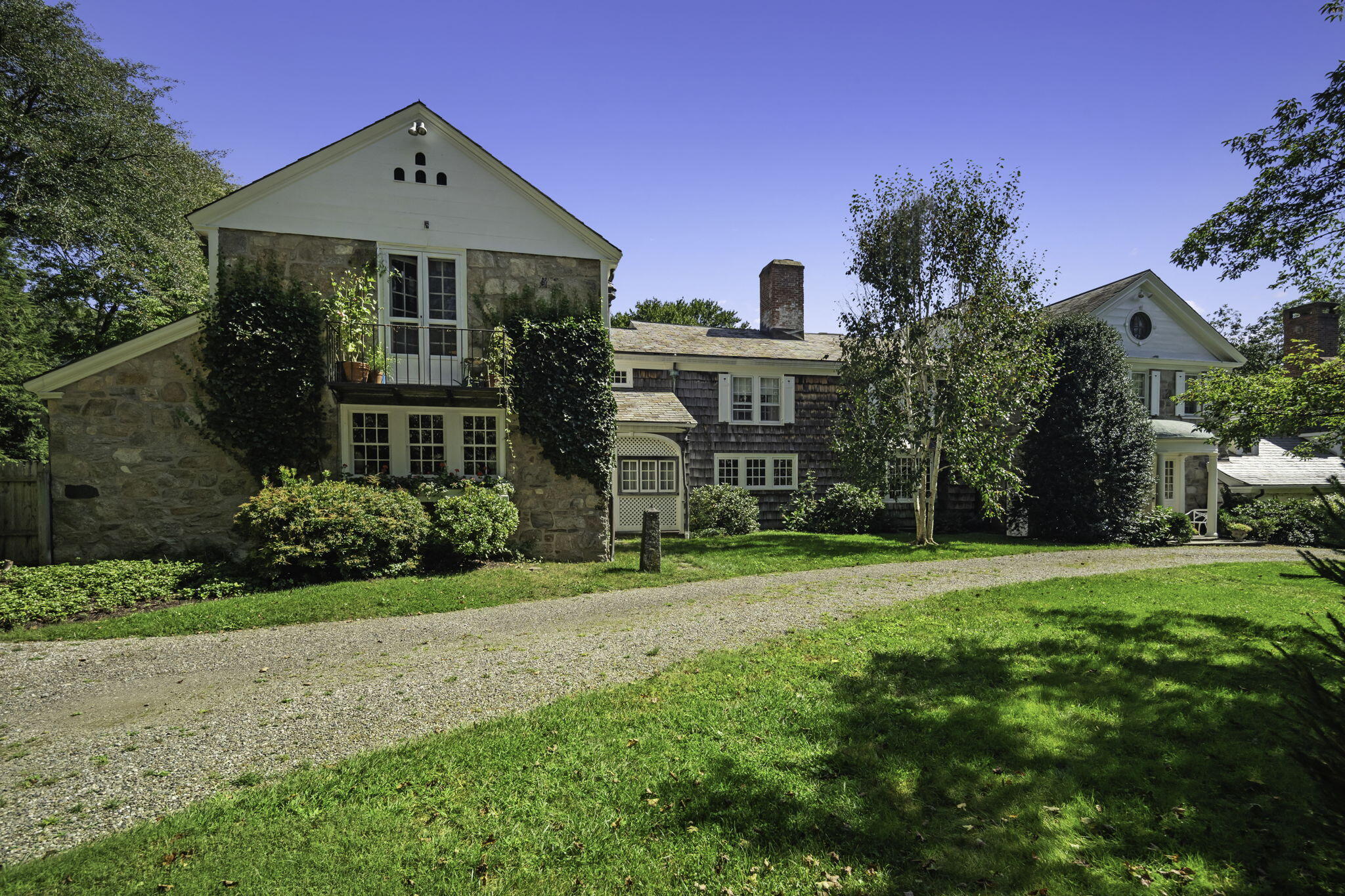 301 Michigan Road New Canaan, CT 06840 - Photo 3 of 46 a front view of a house with a yard