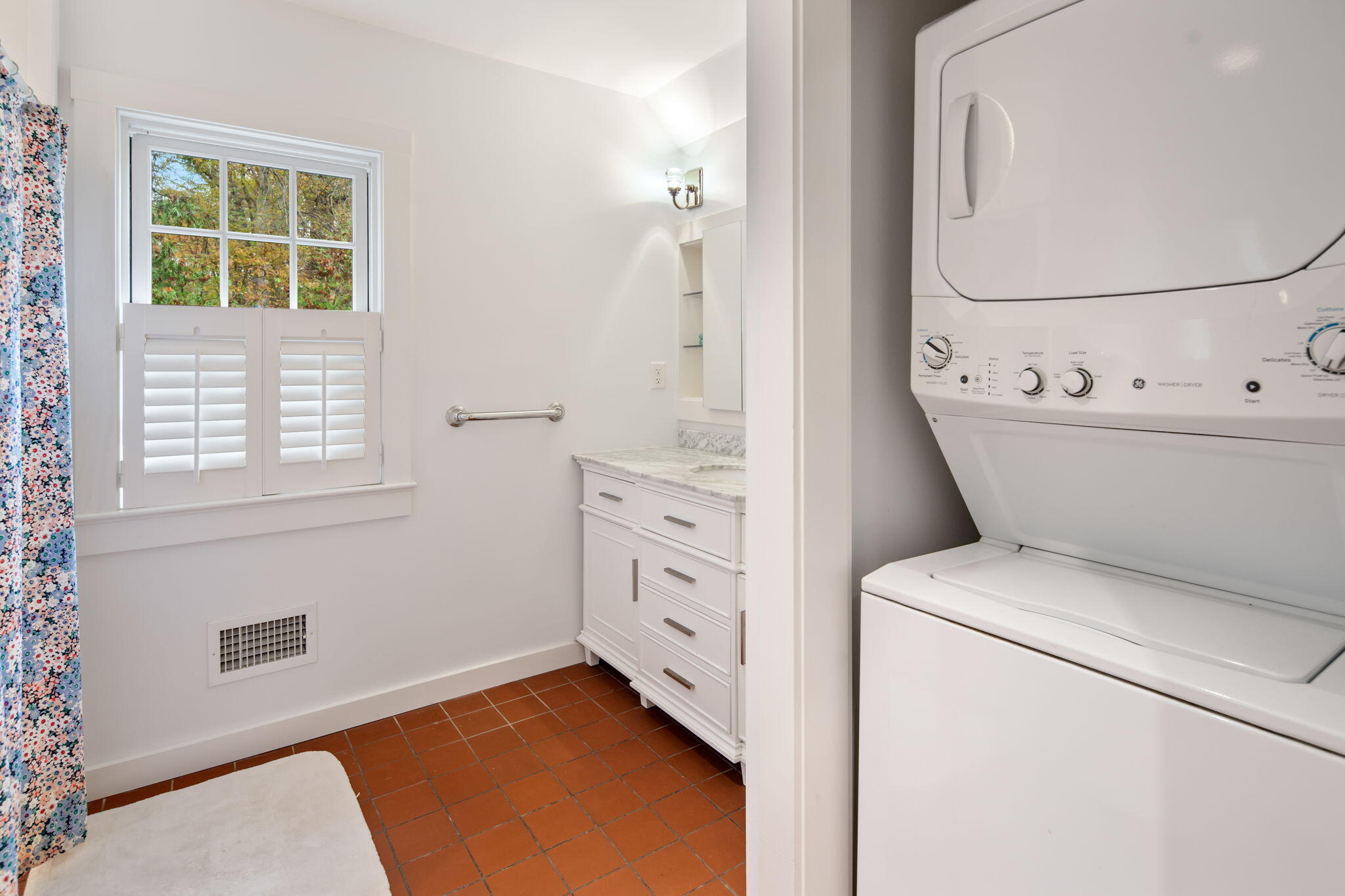 301 Michigan Road New Canaan, CT 06840 - Photo 39 of 46 a view of washer and dryer with bathroom in the background