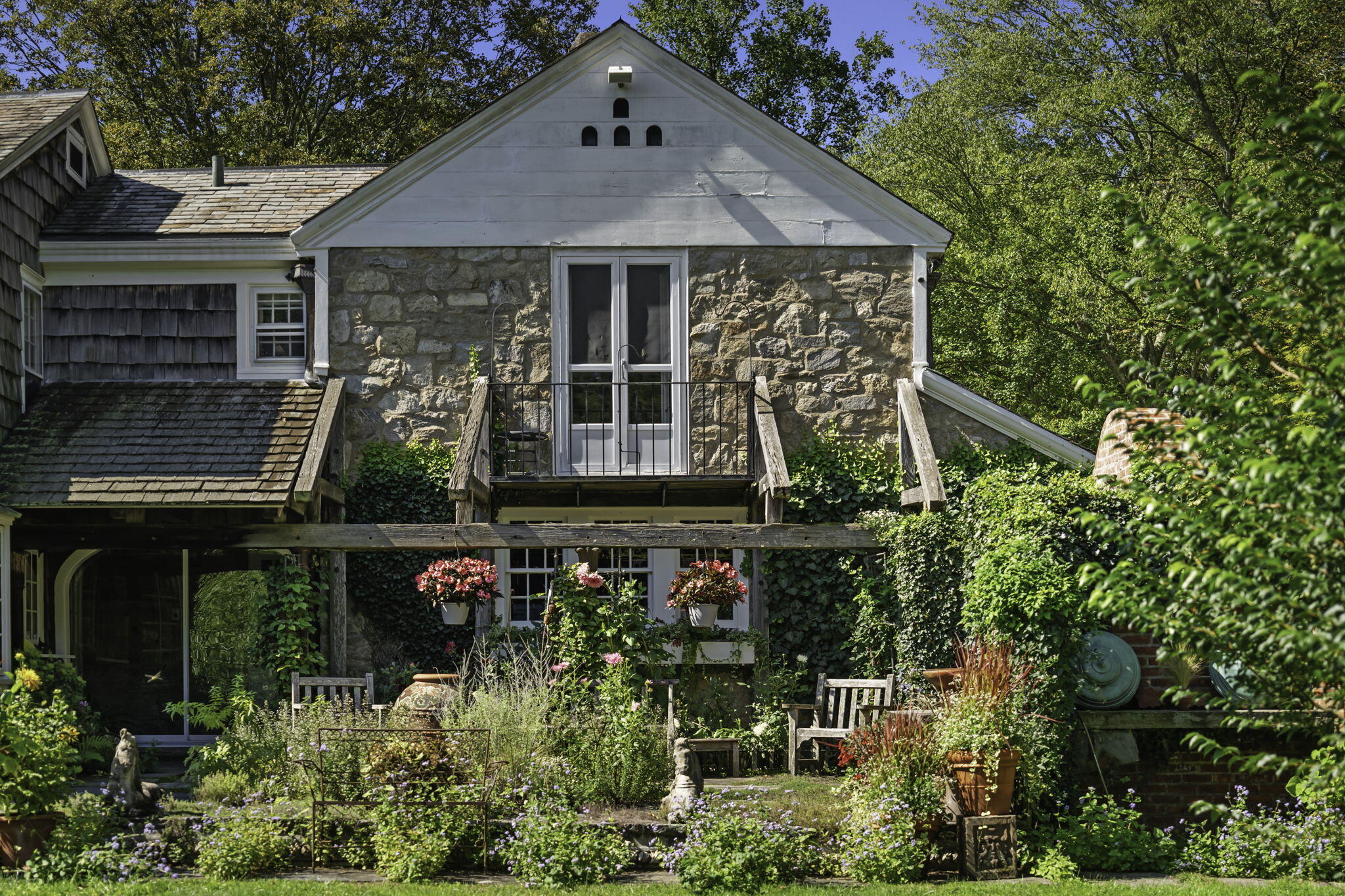 301 Michigan Road New Canaan, CT 06840 - Photo 6 of 46 a front view of a house with garden