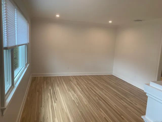 a kitchen with stainless steel appliances granite countertop a stove a refrigerator and a microwave