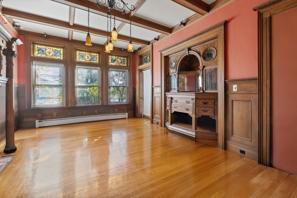 5 Claremont Street Worcester, MA 01610 - Photo 11 of 42 a view of an empty room with window wooden floor and fire place