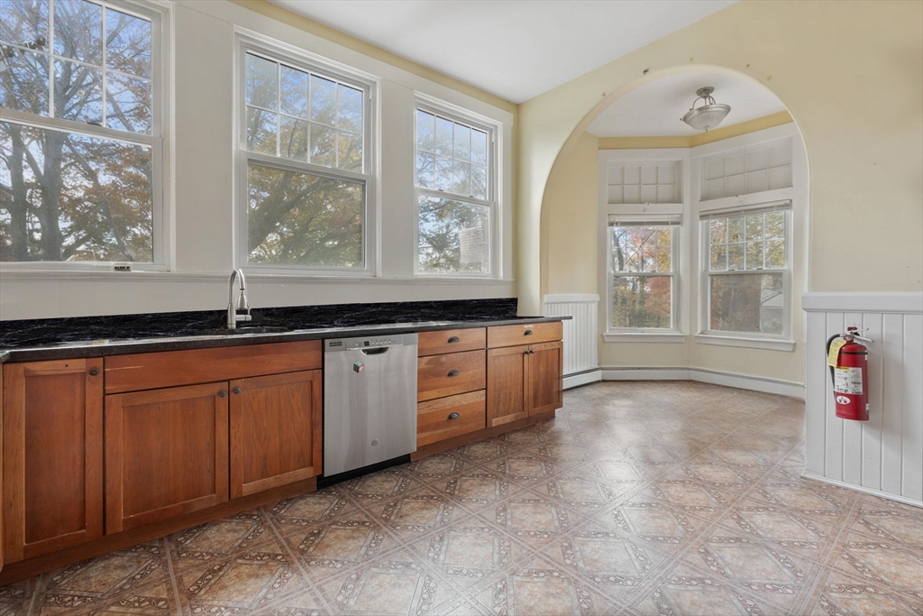 5 Claremont Street Worcester, MA 01610 - Photo 15 of 42 a view of a kitchen with a sink and windows