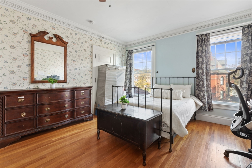 5 Claremont Street Worcester, MA 01610 - Photo 27 of 42 a living room with furniture and wooden floor