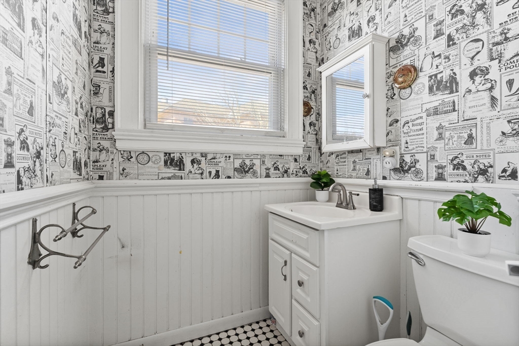 5 Claremont Street Worcester, MA 01610 - Photo 32 of 42 a bathroom with a sink a toilet and vanity