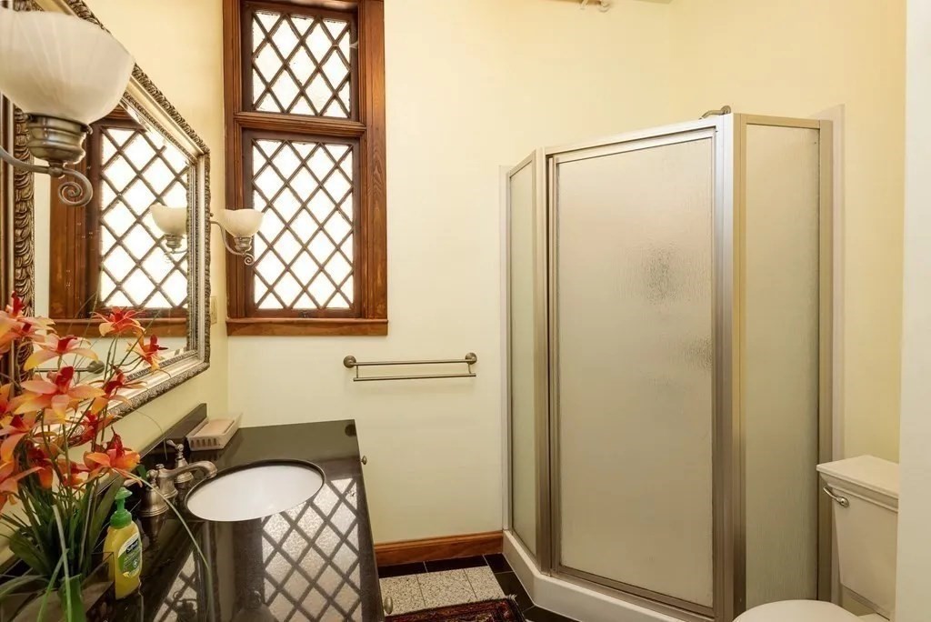 5 Claremont Street Worcester, MA 01610 - Photo 33 of 42 a bathroom with a granite countertop sink toilet and shower