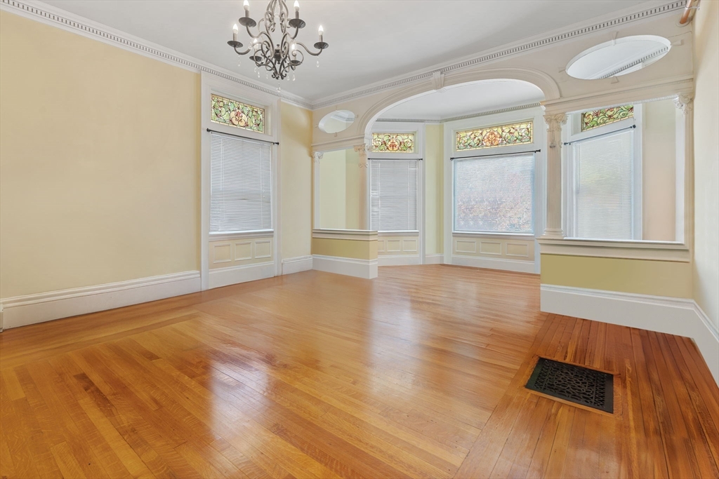 5 Claremont Street Worcester, MA 01610 - Photo 5 of 42 wooden floor in an empty room with a window