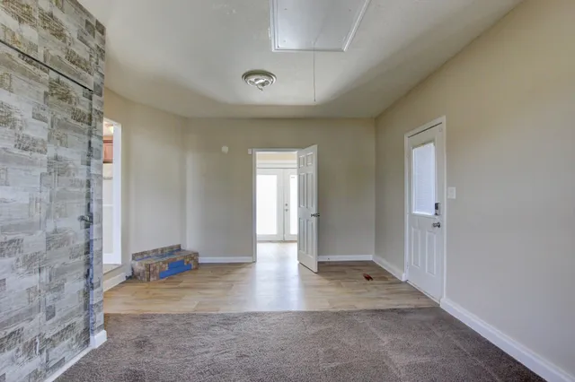 a view of entryway with wooden floor
