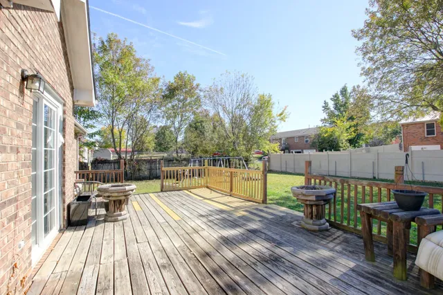 a view of balcony with chairs and wooden floor