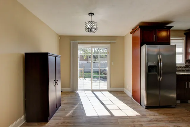 a view of a hallway with windows