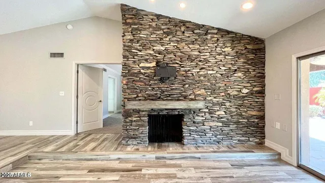 a view of fireplace and wooden floor