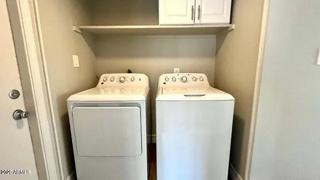 a utility room with dryer and washer