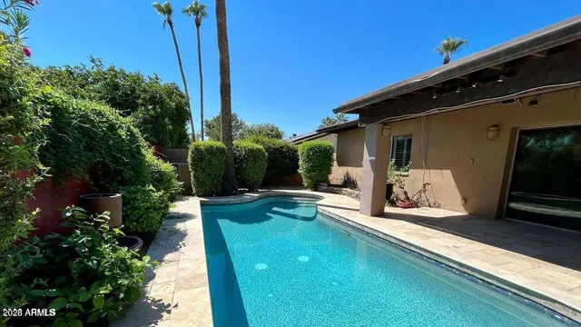 a view of a chair and tables in the balcony