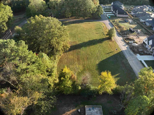 a view of a lake with a building in the background