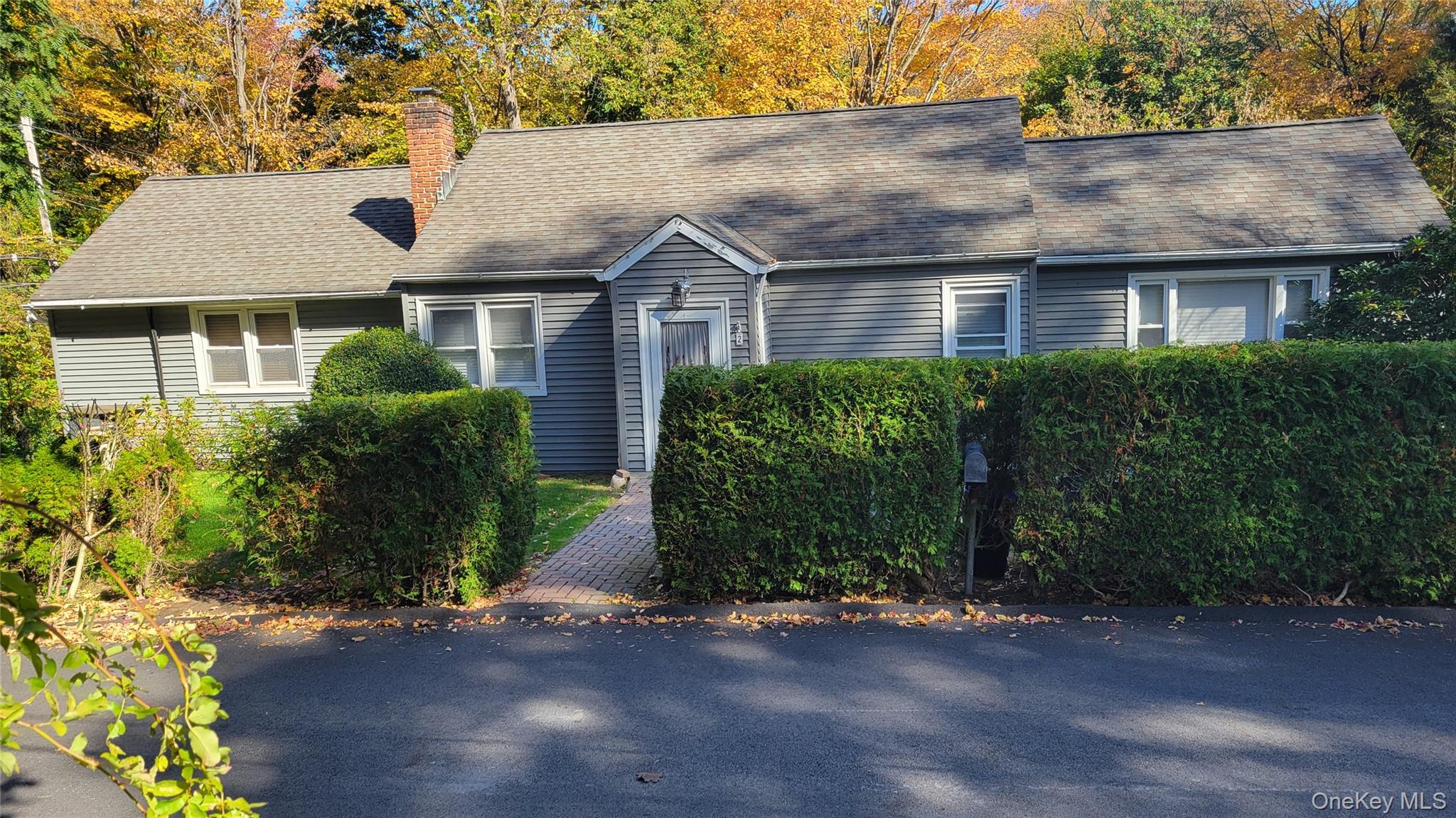 front view of a house with a street
