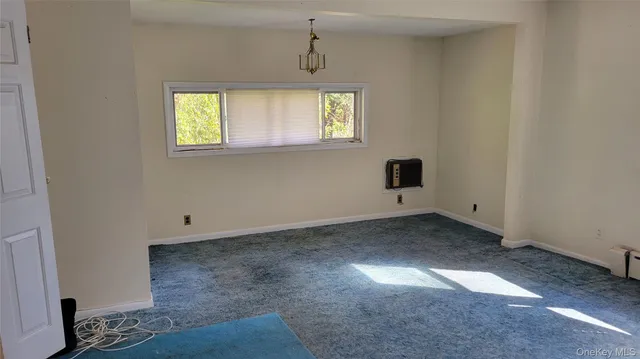 a view of a room with a window