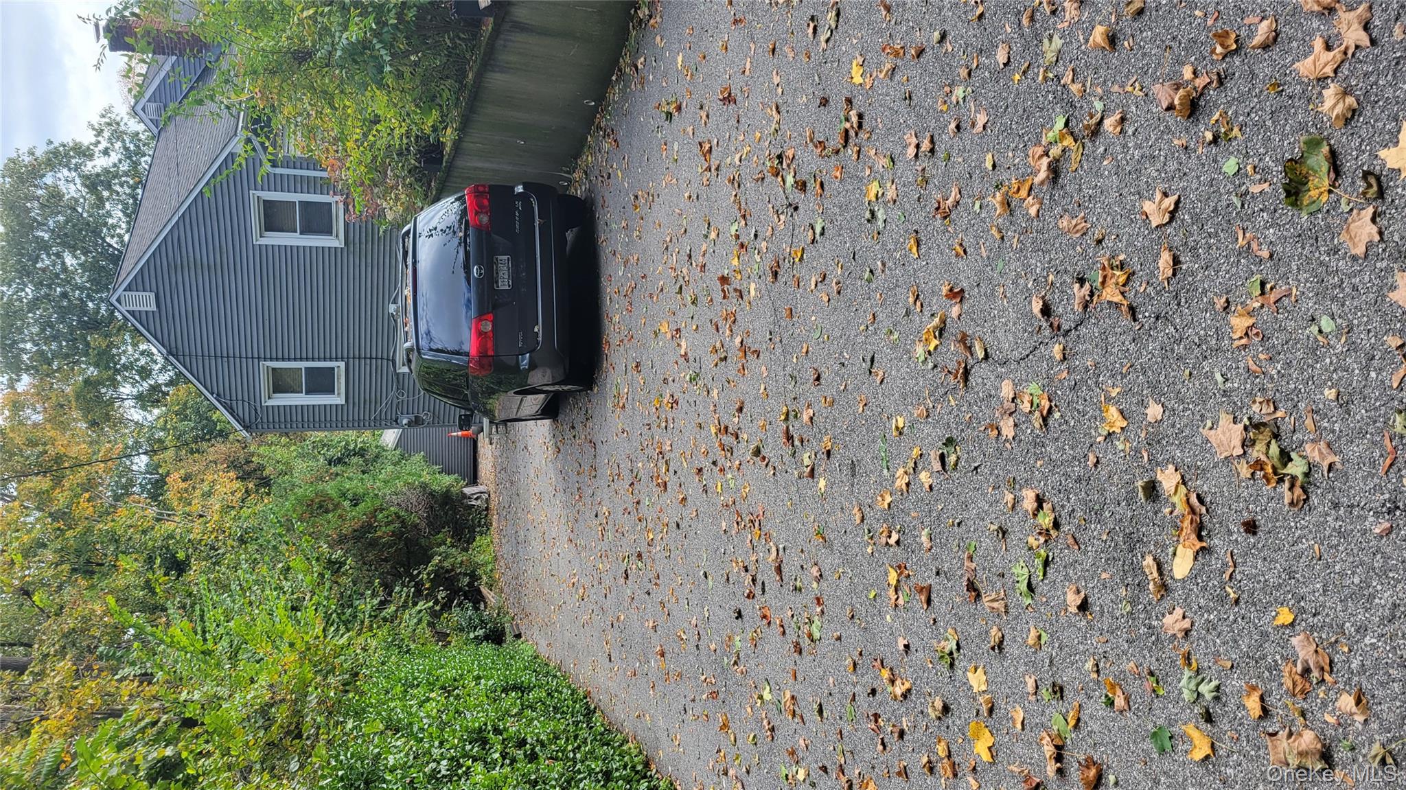 2 Stephens Lane Valhalla, NY 10595 - Photo 6 of 9 a car parked in front of a house