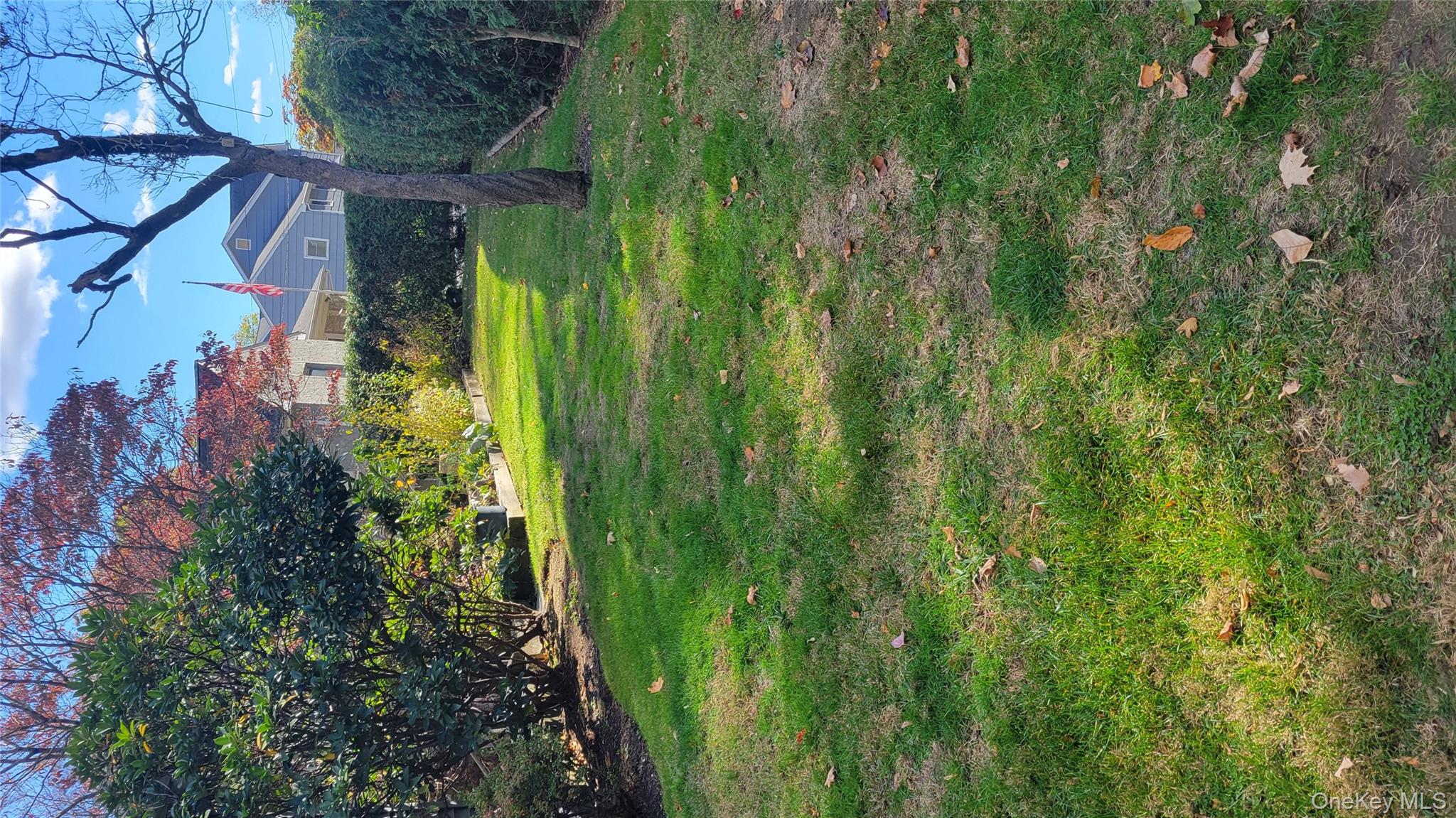 2 Stephens Lane Valhalla, NY 10595 - Photo 9 of 9 a view of a grassy field with an trees