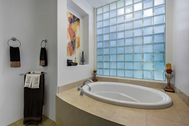 a bathroom with a bathtub and a sink