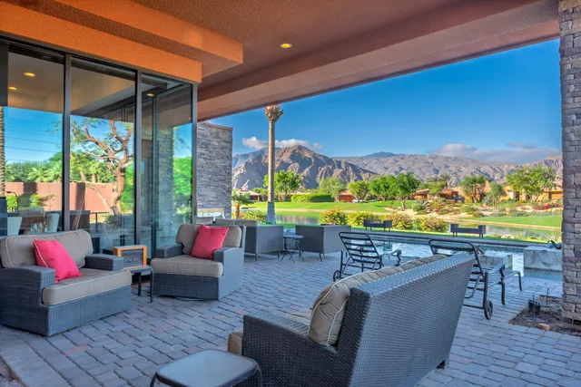 a balcony with furniture and outdoor view