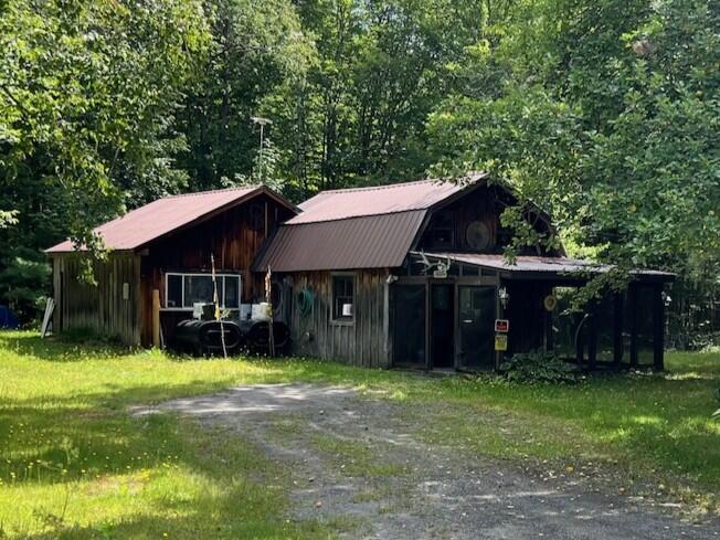 133 Hughes Road Sebec, ME 04481 - Photo 1 of 39 Front