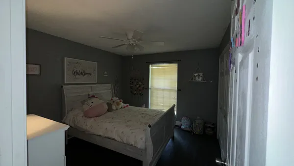 a room with a table chairs and wooden floor