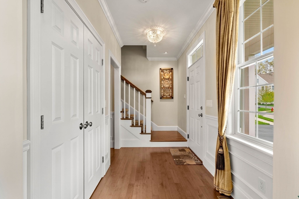 4 Point Shore Overlook Amesbury, MA 01913 - Photo 21 of 42 a view of a hallway with wooden floor and staircase