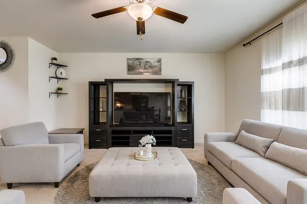 a living room with furniture and a fireplace
