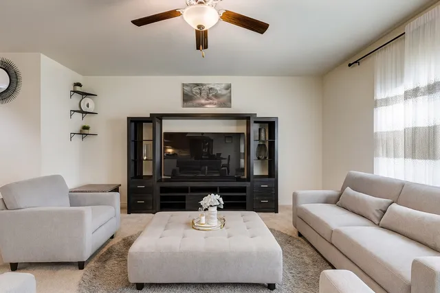 a living room with furniture and a fireplace