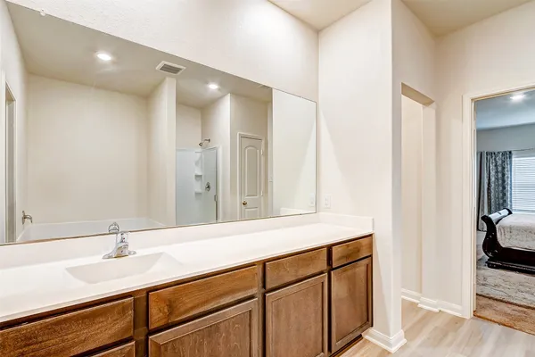 a bathroom with a sink and a mirror